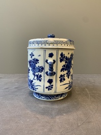 A Chinese blue and white two-handled container and cover with floral design, Kangxi