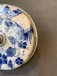 A Chinese blue and white two-handled container and cover with floral design, Kangxi