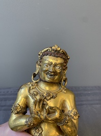 A Sino-Tibetan gilt bronze Virūpa, 19th C.