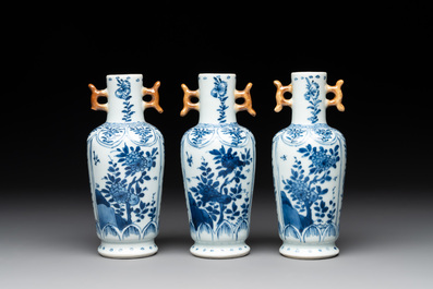 A Chinese blue and white garniture with five vases, Kangxi