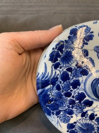 A Chinese blue and white two-handled container and cover with floral design, Kangxi