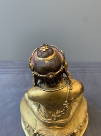 A Sino-Tibetan gilt bronze Virūpa, 19th C.