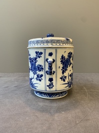 A Chinese blue and white two-handled container and cover with floral design, Kangxi