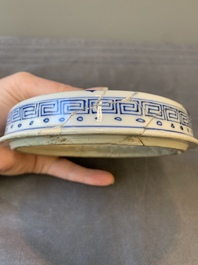 A Chinese blue and white two-handled container and cover with floral design, Kangxi