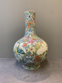 A fine Chinese famille rose 'millefleurs' bottle vase with immortals, Kangxi mark, Republic