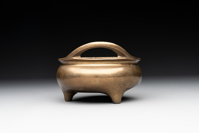 A Chinese bronze tripod censer with two handles, Xuande mark, 19th C.