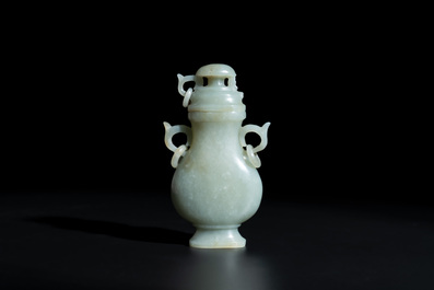 A Chinese white and russet jade lotus-form brush washer and two covered vases, Qing