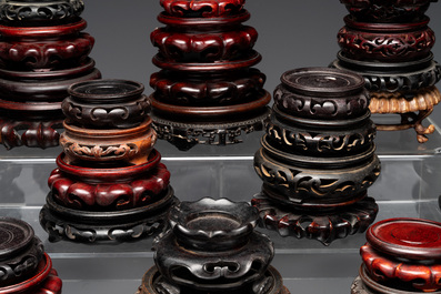 A large collection of 87 Chinese wooden stands, 19/20th C.