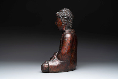 A gilt and lacquered wooden Buddha, Vietnam, 19th C.
