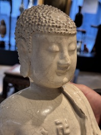 An extremely rare Chinese Swatow cream-glazed seated Buddha, Xuande mark, Ming