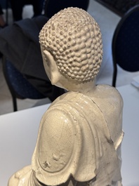 An extremely rare Chinese Swatow cream-glazed seated Buddha, Xuande mark, Ming
