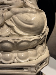 An extremely rare Chinese Swatow cream-glazed seated Buddha, Xuande mark, Ming