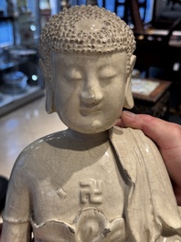 An extremely rare Chinese Swatow cream-glazed seated Buddha, Xuande mark, Ming
