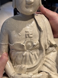 An extremely rare Chinese Swatow cream-glazed seated Buddha, Xuande mark, Ming