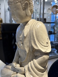 An extremely rare Chinese Swatow cream-glazed seated Buddha, Xuande mark, Ming