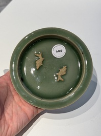 A Chinese Longquan celadon 'twin fish' plate, Yuan/Ming