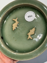 A Chinese Longquan celadon 'twin fish' plate, Yuan/Ming
