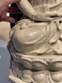 An extremely rare Chinese Swatow cream-glazed seated Buddha, Xuande mark, Ming