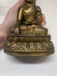 A fine Sino-Tibetan gilt bronze Buddha, 15/16th C.