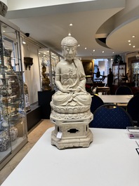 An extremely rare Chinese Swatow cream-glazed seated Buddha, Xuande mark, Ming