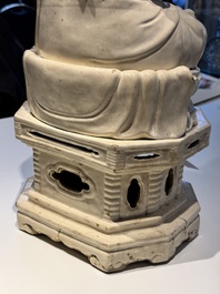 An extremely rare Chinese Swatow cream-glazed seated Buddha, Xuande mark, Ming
