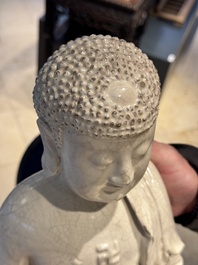 An extremely rare Chinese Swatow cream-glazed seated Buddha, Xuande mark, Ming