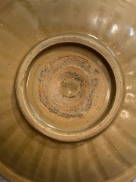 A Chinese Longquan celadon plate and two saucer dishes, Ming