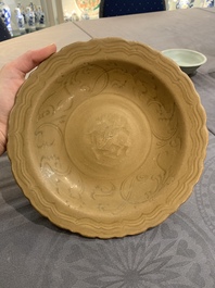 A Chinese Longquan celadon plate and two saucer dishes, Ming