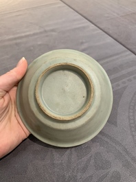 A Chinese Longquan celadon plate and two saucer dishes, Ming