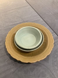 A Chinese Longquan celadon plate and two saucer dishes, Ming