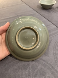 A Chinese Longquan celadon plate and two saucer dishes, Ming