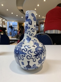Three Chinese blue and white vases with antiquities, dragons and figures, 19th C.
