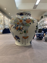 A Chinese wucai vase and seven blue and white jarlets, 19th C.