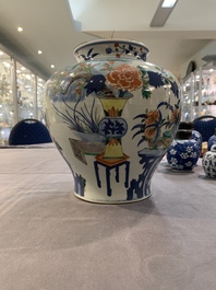A Chinese wucai vase and seven blue and white jarlets, 19th C.