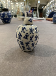 A Chinese wucai vase and seven blue and white jarlets, 19th C.