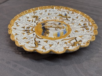 A polychrome Dutch maiolica 'putto' plate, Verstraeten workshop, Haarlem, 17th C.