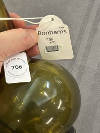 A rare Chinese translucent green Peking glass bottle vase, Qianlong mark and of the period