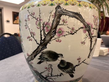A Chinese famille rose 'magpies and plum blossoms' vase on wooden stand, 19th C.