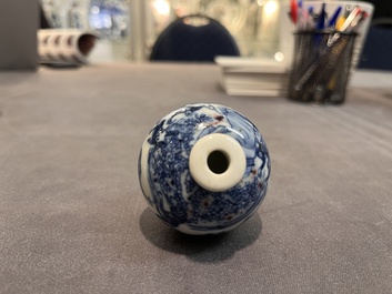 A Chinese blue, white and copper-red 'monkeys' snuff bottle, Yongzheng mark, 19th C.