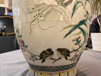 A Chinese famille rose 'magpies and plum blossoms' vase on wooden stand, 19th C.