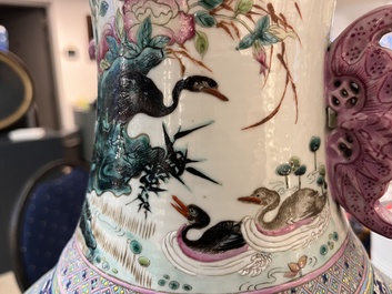 A Chinese famille rose 'magpies and plum blossoms' vase on wooden stand, 19th C.