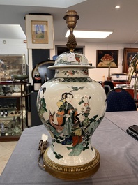 A Chinese famille verte vase and cover mounted as a lamp, 19th C.