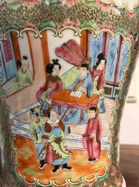 A pair of Chinese Canton famille rose vases and covers with narrative design, 19th C.