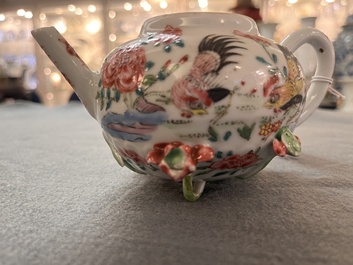 A Chinese famille rose 'rooster' teapot with applied floral design and a cup, Yongzheng/Qianlong