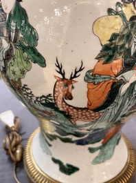 A Chinese famille verte vase and cover mounted as a lamp, 19th C.