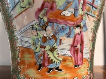 A pair of Chinese Canton famille rose vases and covers with narrative design, 19th C.