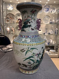 A Chinese famille rose 'magpies and plum blossoms' vase on wooden stand, 19th C.