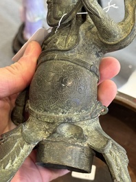 A Vietnamese bronze brush washer on stand and a Chinese bronze warrior on horseback, 19th C.