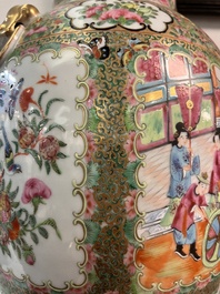 A pair of Chinese Canton famille rose vases and covers with narrative design, 19th C.
