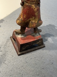 A Chinese gilt-lacquered bronze offering figure on stand, Ming